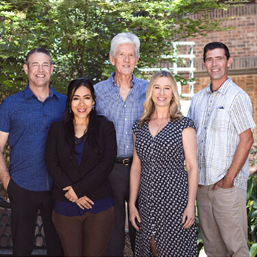 Dr. Sanders and Dr. Peters caring for an Austin family